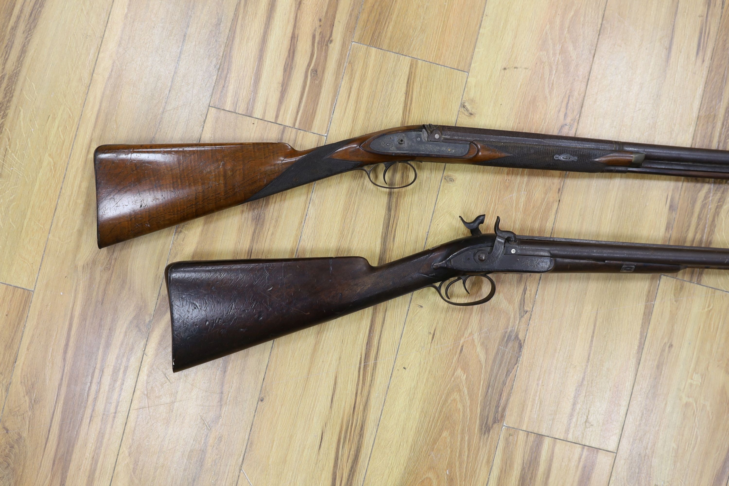 Two 19th century percussion muskets, 103cm. max., one double-barrelled